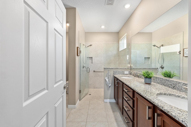 7753 SW 86th Loop, Ocala, FL 34476 - bathroom with a shower stall, double vanity, tile patterned floors, baseboards, and recessed lighting