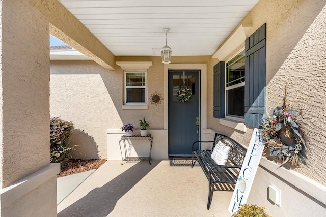 7753 SW 86th Loop, Ocala, FL 34476 - property entrance with stucco siding and covered porch