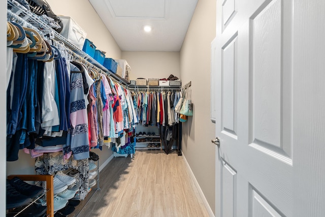 7753 SW 86th Loop, Ocala, FL 34476 - walk in closet featuring wood finished floors and attic access