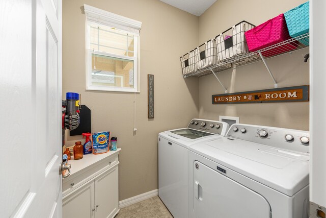 7753 SW 86th Loop, Ocala, FL 34476 - laundry room featuring washing machine and dryer, baseboards, and cabinet space