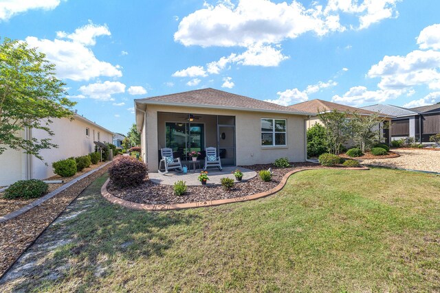 7753 SW 86th Loop, Ocala, FL 34476 - back of property with a ceiling fan, a lawn, and a patio