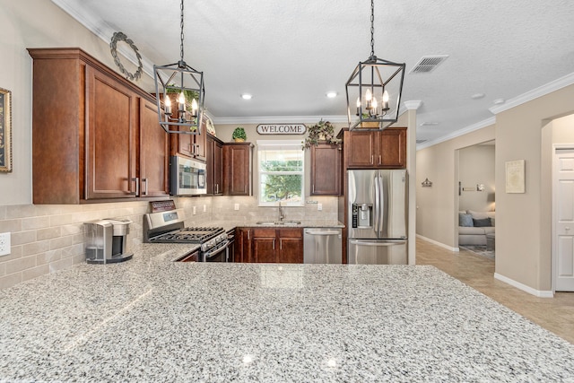 7753 SW 86th Loop, Ocala, FL 34476 - kitchen with appliances with stainless steel finishes, a chandelier, light stone counters, a sink, and recessed lighting