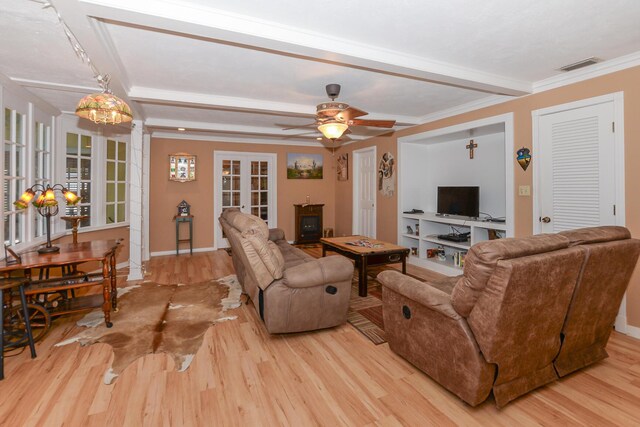 living room featuring light wood-style floors, french doors, baseboards, beamed ceiling, and visible vents