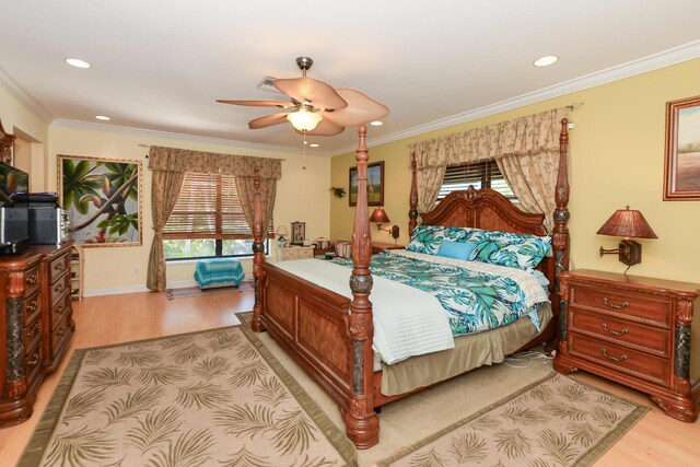 bedroom with recessed lighting, light wood-style flooring, and multiple windows
