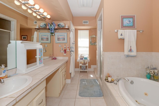 bathroom with vanity, tile patterned floors, a stall shower, and visible vents