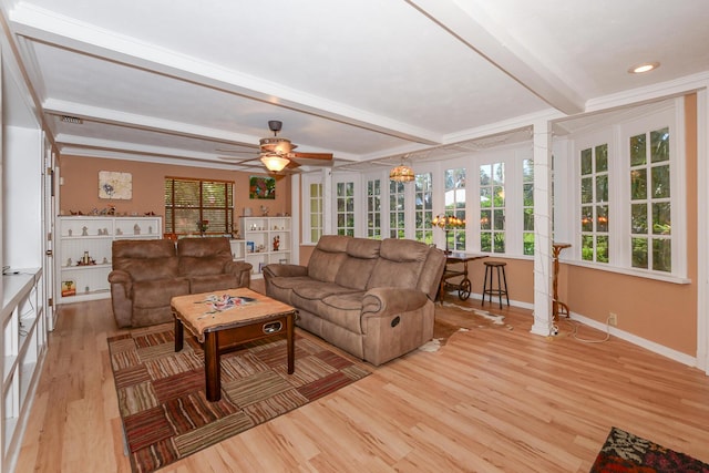 living room featuring decorative columns, beamed ceiling, light wood-style floors, baseboards, and a ceiling fan
