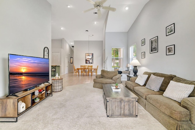 9225 Wentworth Ln, Port Saint Lucie, FL 34986 - tiled living area featuring carpet floors, ceiling fan, high vaulted ceiling, and recessed lighting