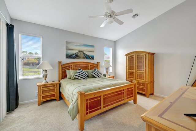 9225 Wentworth Ln, Port Saint Lucie, FL 34986 - bedroom with vaulted ceiling, visible vents, multiple windows, and light colored carpet