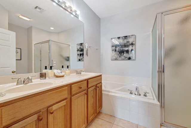 9225 Wentworth Ln, Port Saint Lucie, FL 34986 - full bathroom featuring a garden tub, tile patterned flooring, visible vents, a sink, and a stall shower