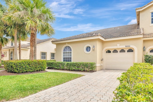 9225 Wentworth Ln, Port Saint Lucie, FL 34986 - mediterranean / spanish home with a garage and stucco siding