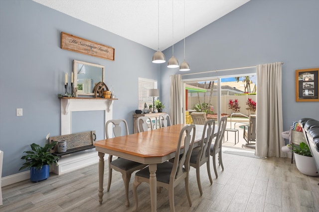 1103 Aviary Rd, Wellington, FL 33414 - dining space with light wood-type flooring and high vaulted ceiling