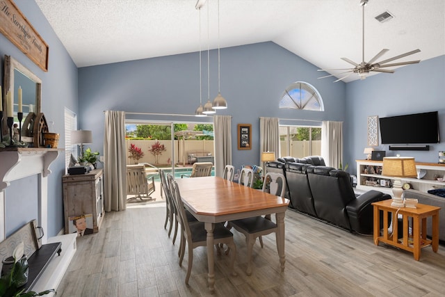 1103 Aviary Rd, Wellington, FL 33414 - dining room featuring high vaulted ceiling, a ceiling fan, visible vents, light wood finished floors, and plenty of natural light
