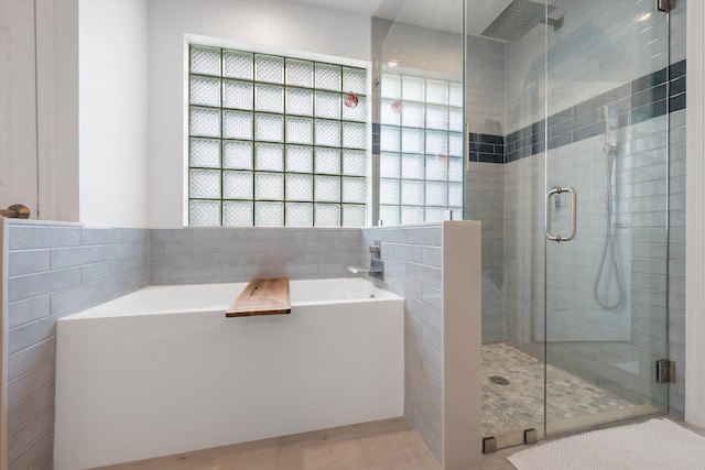 1103 Aviary Rd, Wellington, FL 33414 - full bath featuring a shower stall, tile walls, and a garden tub