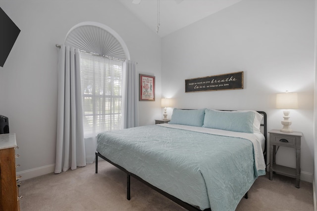 1103 Aviary Rd, Wellington, FL 33414 - bedroom with light carpet, high vaulted ceiling, and baseboards