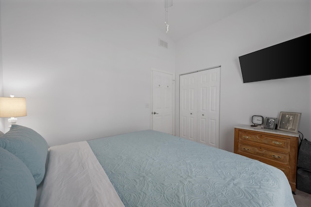 1103 Aviary Rd, Wellington, FL 33414 - carpeted bedroom featuring a closet, high vaulted ceiling, ceiling fan, and visible vents