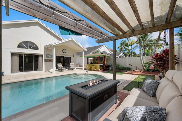 1103 Aviary Rd, Wellington, FL 33414 - view of swimming pool with an outdoor living space with a fire pit, a fenced in pool, a patio area, and a fenced backyard