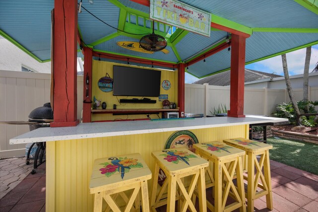 1103 Aviary Rd, Wellington, FL 33414 - view of patio / terrace featuring outdoor dry bar and fence
