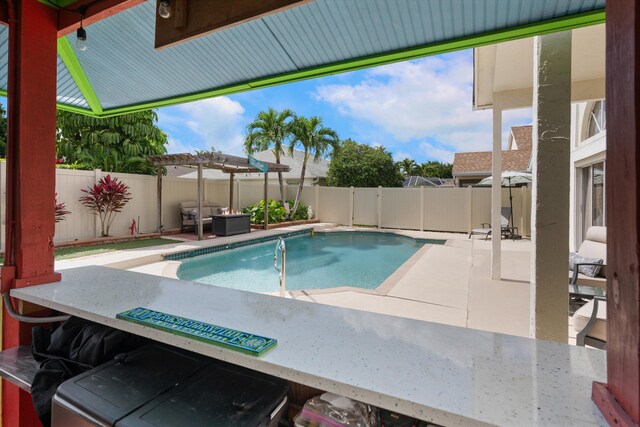 1103 Aviary Rd, Wellington, FL 33414 - view of swimming pool with a pergola, a patio, a fenced backyard, and a fenced in pool