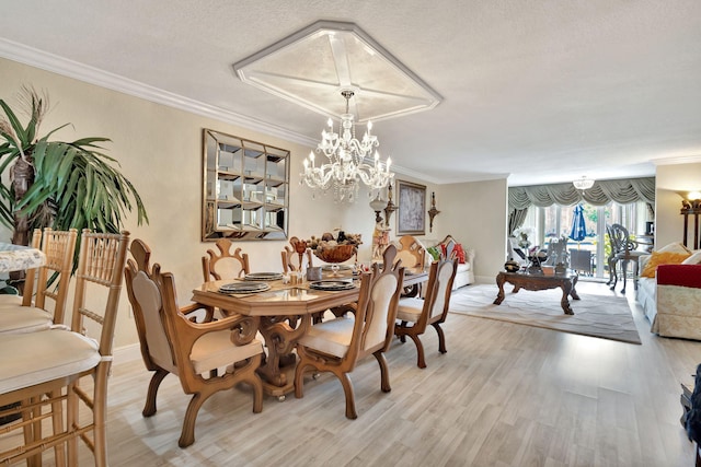 5749 Gemstone Ct Unit 107, Boynton Beach, FL 33437 - dining area with light wood-type flooring, a chandelier, and crown molding