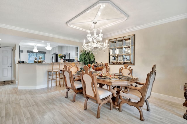 5749 Gemstone Ct Unit 107, Boynton Beach, FL 33437 - dining space with light wood-style flooring, baseboards, a chandelier, and ornamental molding
