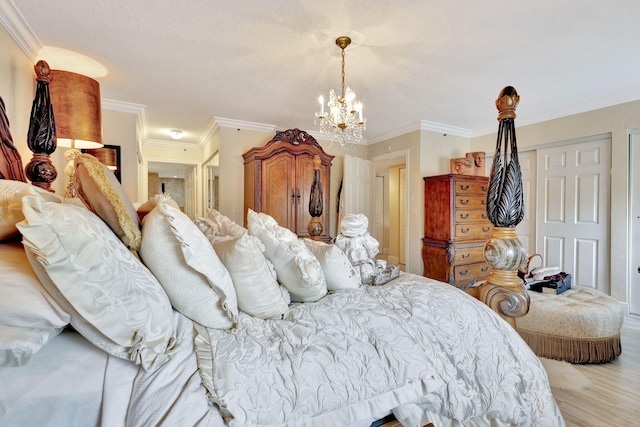 5749 Gemstone Ct Unit 107, Boynton Beach, FL 33437 - bedroom featuring a closet, ornamental molding, a chandelier, and light wood-type flooring
