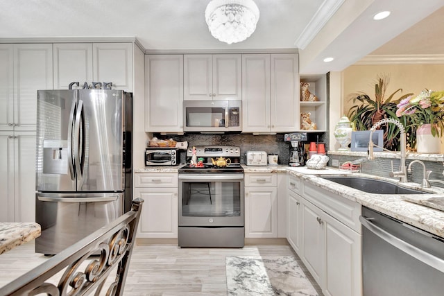 5749 Gemstone Ct Unit 107, Boynton Beach, FL 33437 - kitchen with stainless steel appliances, open shelves, backsplash, ornamental molding, and a sink