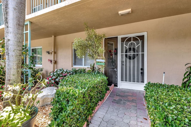 5749 Gemstone Ct Unit 107, Boynton Beach, FL 33437 - property entrance featuring stucco siding