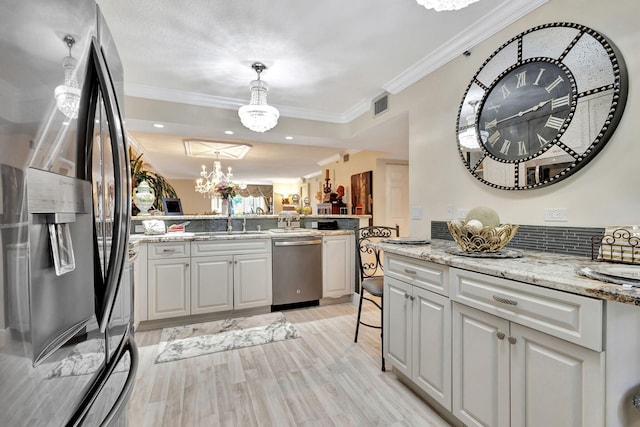 5749 Gemstone Ct Unit 107, Boynton Beach, FL 33437 - kitchen featuring an inviting chandelier, appliances with stainless steel finishes, light wood-style flooring, ornamental molding, and visible vents