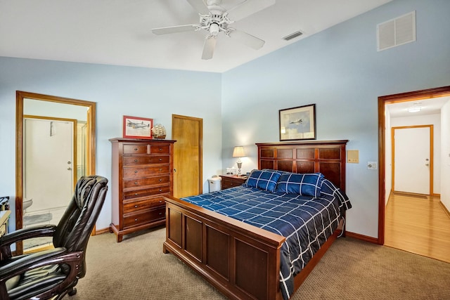 3120 SE Downwinds Rd, Jupiter, FL 33478 - bedroom with lofted ceiling, light colored carpet, and visible vents
