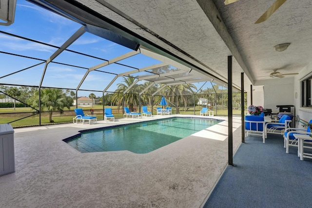 3120 SE Downwinds Rd, Jupiter, FL 33478 - outdoor pool featuring a lanai, ceiling fan, and a patio area