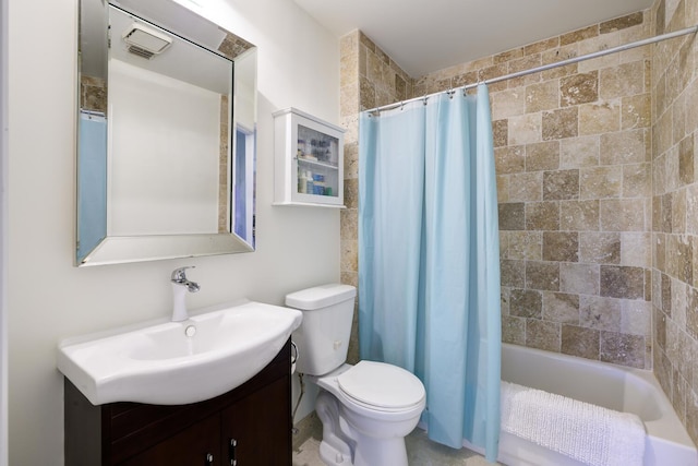 full bathroom featuring shower / bath combo, vanity, and toilet