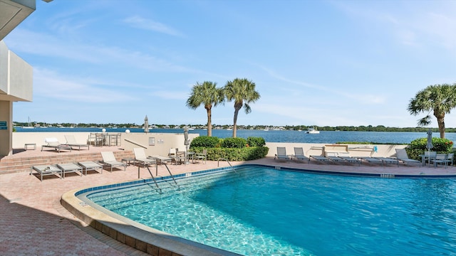 136 Lakeshore Dr Unit Ph-13, North Palm Beach, FL 33408 - pool with a water view and a patio area