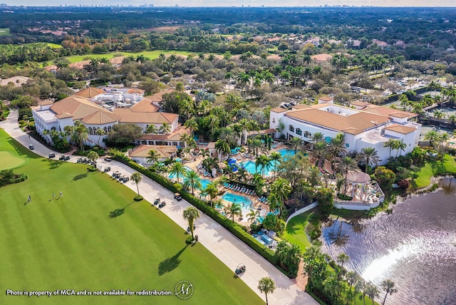 birds eye view of property featuring view of golf course and a water view