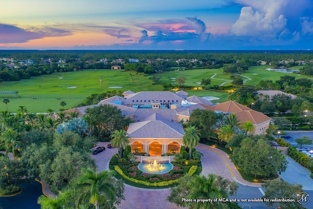 bird's eye view featuring golf course view and a water view
