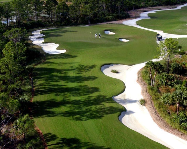 surrounding community featuring view of golf course