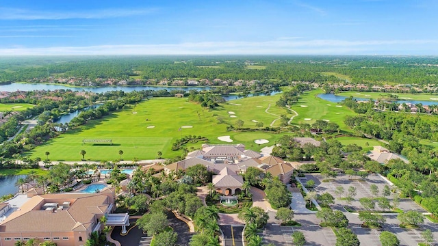 aerial view featuring view of golf course and a water view