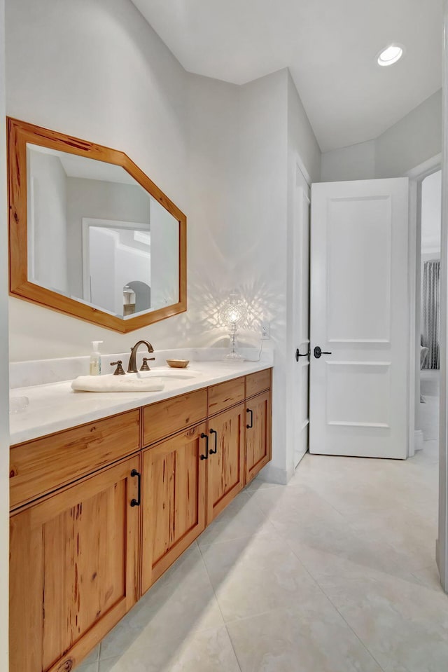 bathroom featuring recessed lighting and vanity
