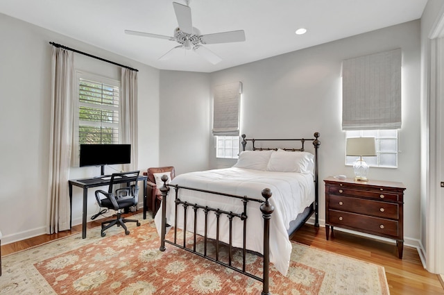 bedroom with recessed lighting, a ceiling fan, baseboards, and light wood-style floors