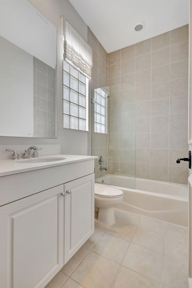 full bathroom with tile patterned floors, washtub / shower combination, toilet, and vanity