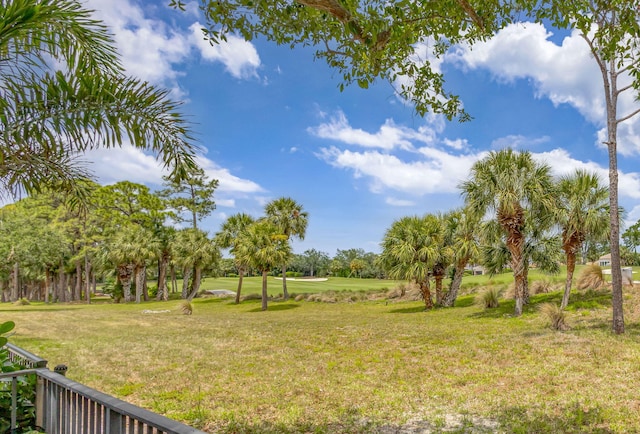 view of yard with view of golf course