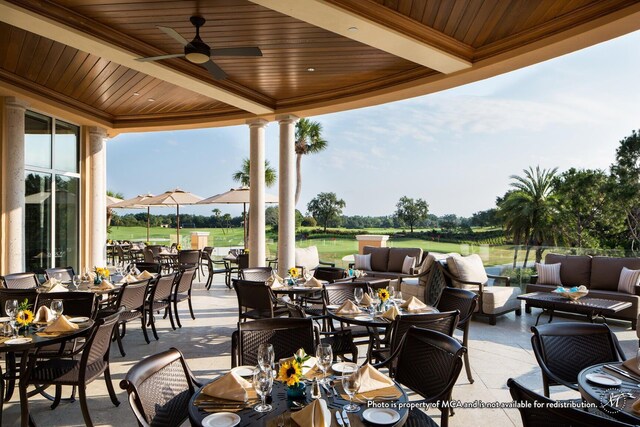 view of patio with outdoor dining space, a ceiling fan, an outdoor hangout area, and view of golf course