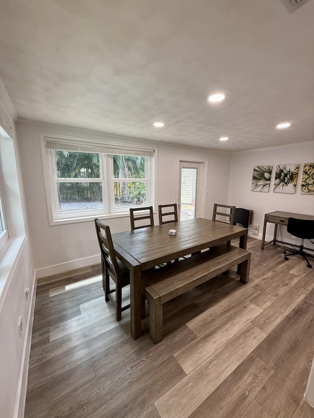 dining area featuring recessed lighting, baseboards, and wood finished floors