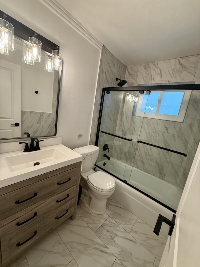 full bathroom featuring bath / shower combo with glass door, vanity, marble finish floor, and toilet