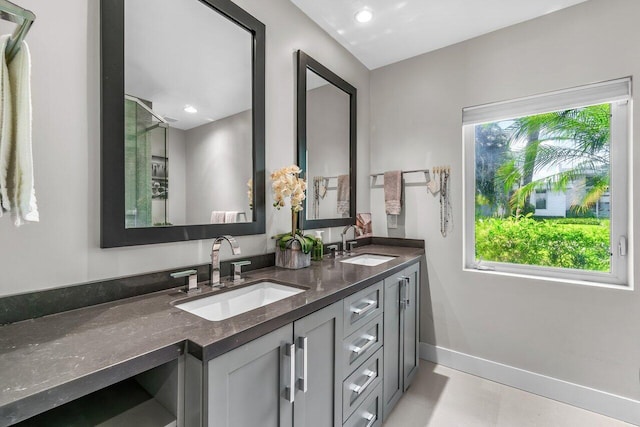 225 NW 11th St, Delray Beach, FL 33444 - full bath featuring plenty of natural light, double vanity, baseboards, tile patterned flooring, and recessed lighting