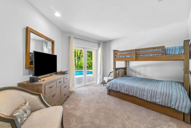 225 NW 11th St, Delray Beach, FL 33444 - bedroom with access to outside and light colored carpet
