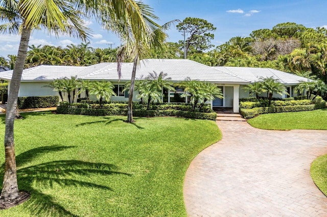 225 NW 11th St, Delray Beach, FL 33444 - ranch-style house featuring a front yard, stucco siding, and a tiled roof