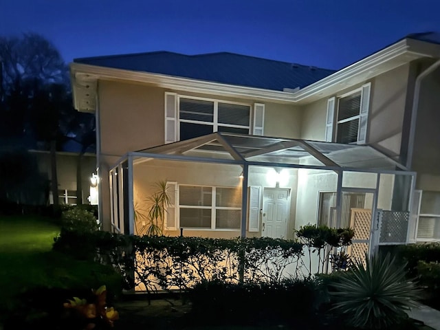 2415 SW Danbury Ln, Palm City, FL 34990 - back of house at twilight with stucco siding