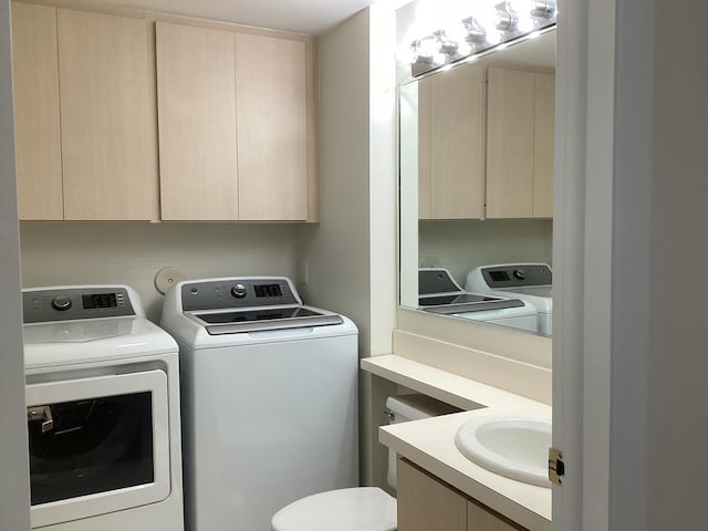 2415 SW Danbury Ln, Palm City, FL 34990 - laundry area with a sink, separate washer and dryer, and laundry area