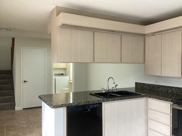 2415 SW Danbury Ln, Palm City, FL 34990 - kitchen with washer / dryer, light brown cabinets, dark countertops, a sink, and dishwasher