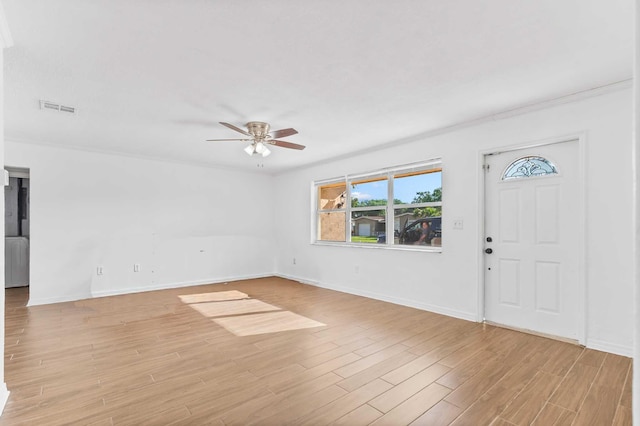 entrance foyer with visible vents, ceiling fan, light wood-type flooring, and baseboards